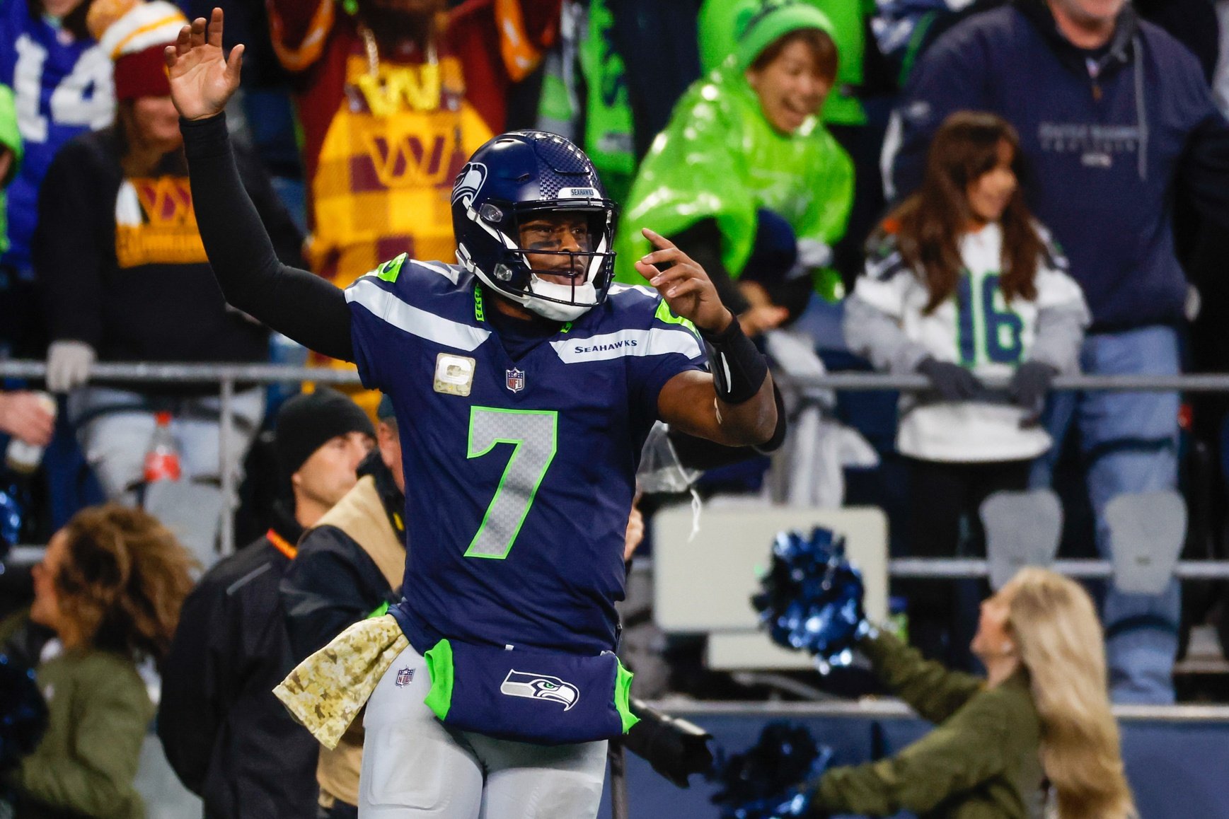 Seattle Seahawks quarterback Geno Smith (7) celebrates after throwing a touchdown pass against the Washington Commanders during the fourth quarter at Lumen Field.