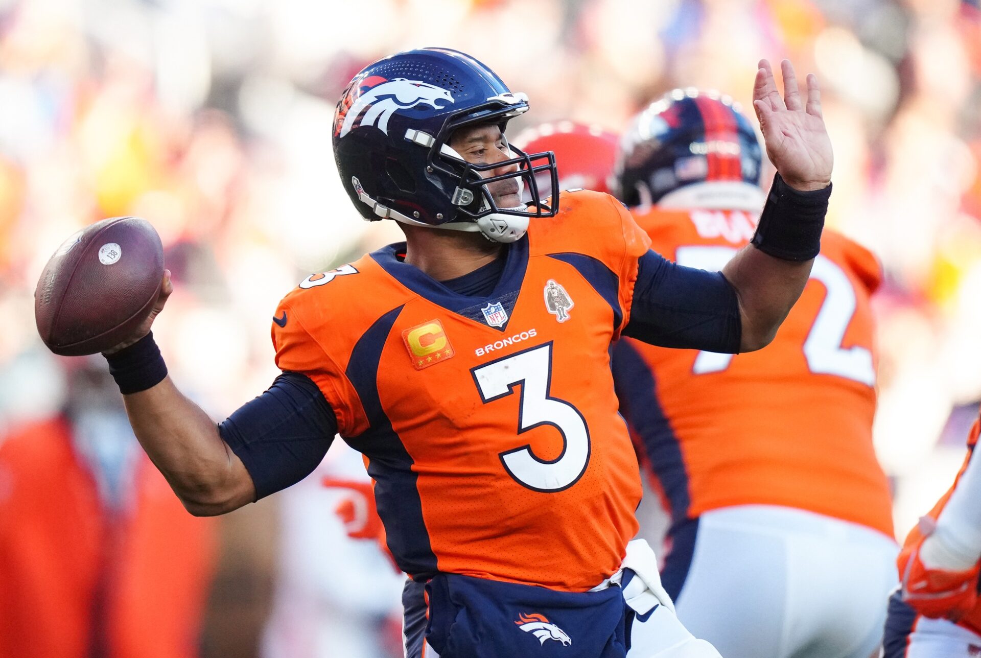 Denver Broncos quarterback Russell Wilson (3) throws the ball in the second quarter against the Cleveland Browns at Empower Field at Mile High.