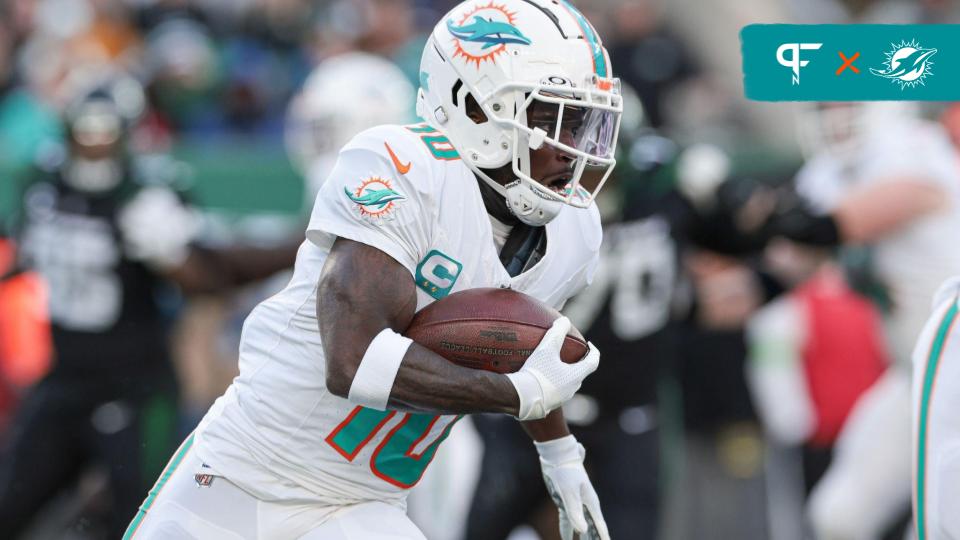 Miami Dolphins WR Tyreek Hill carries the football.