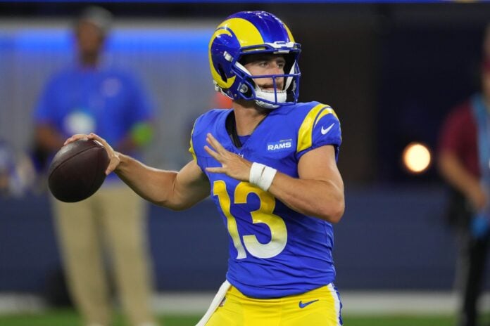 Los Angeles Rams quarterback Stetson Bennett (13) throws the ball in the second half against the Los Angeles Chargers at SoFi Stadium.