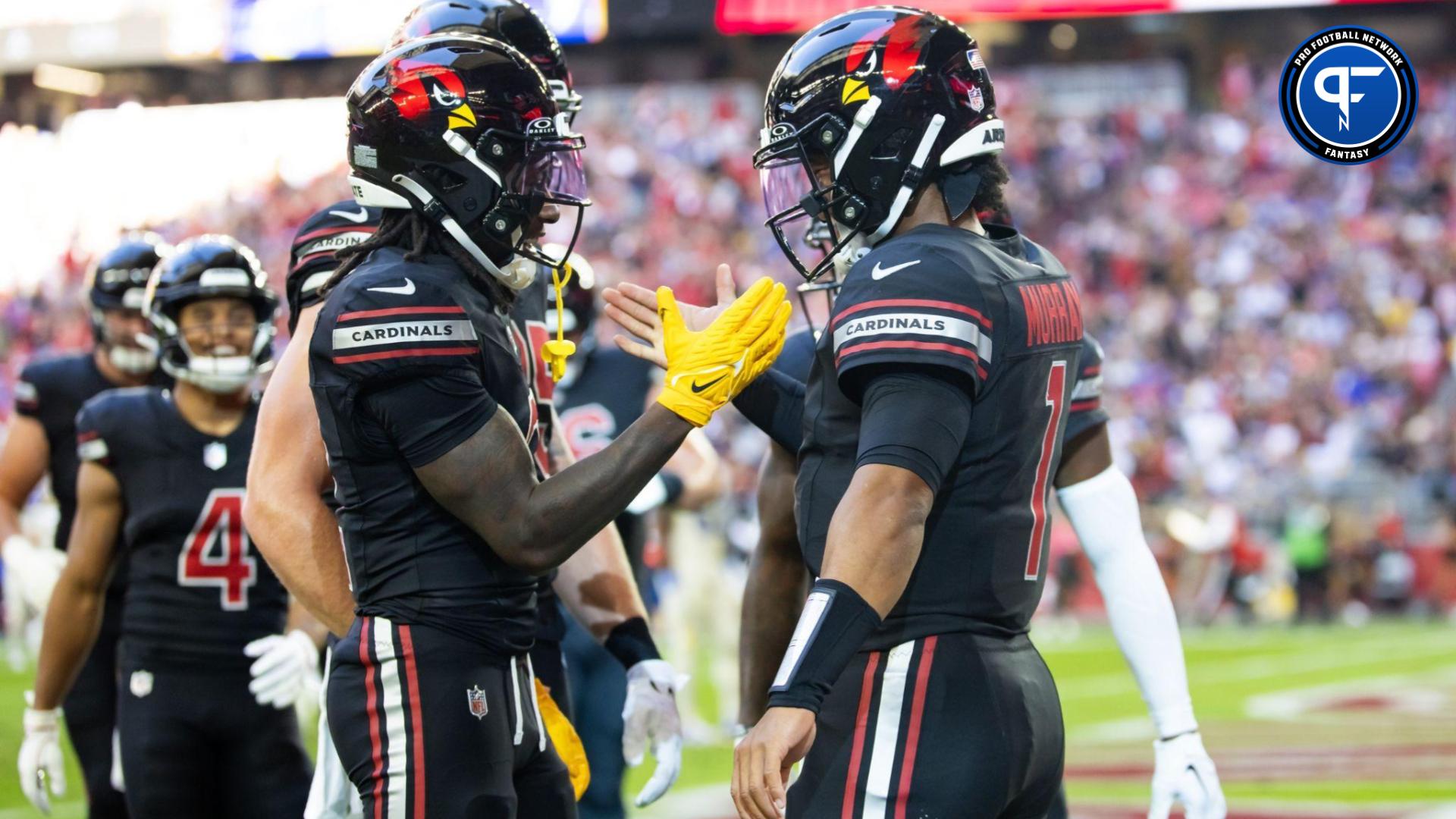 Kyler Murray (right) celebrates a touchdown with wide receiver Marquise Brown against the Los Angeles Rams in the first half at State Farm Stadium.