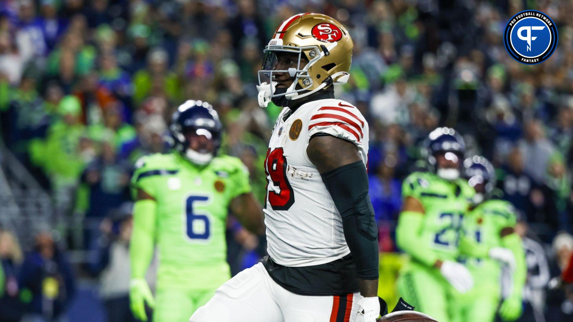 San Francisco 49ers wide receiver Deebo Samuel (19) celebrates after rushing for a touchdown against the Seattle Seahawks during the first quarter at Lumen Field.
