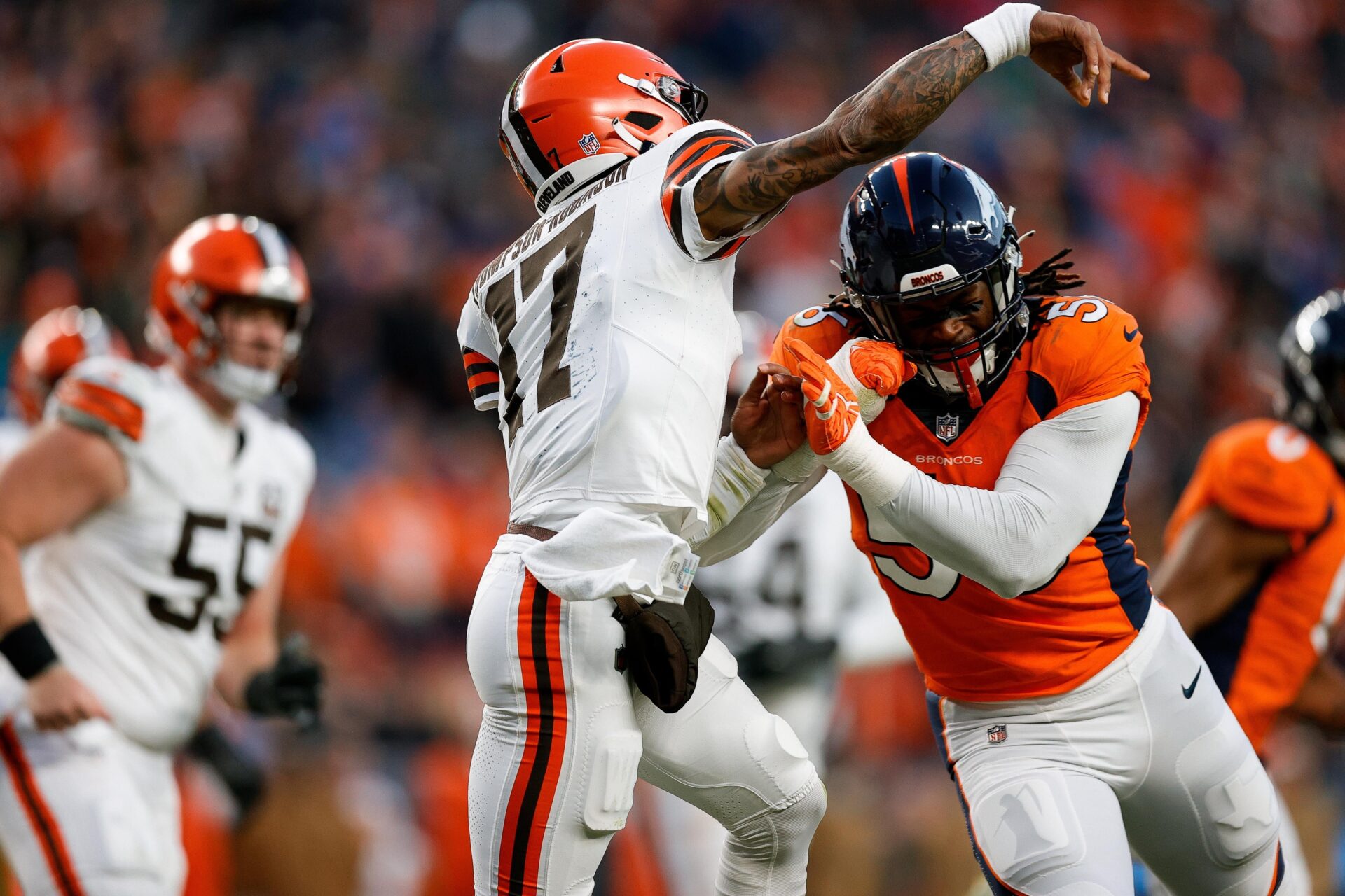 Cleveland Browns quarterback Dorian Thompson-Robinson (17) is hit by Denver Broncos linebacker Baron Browning (56).