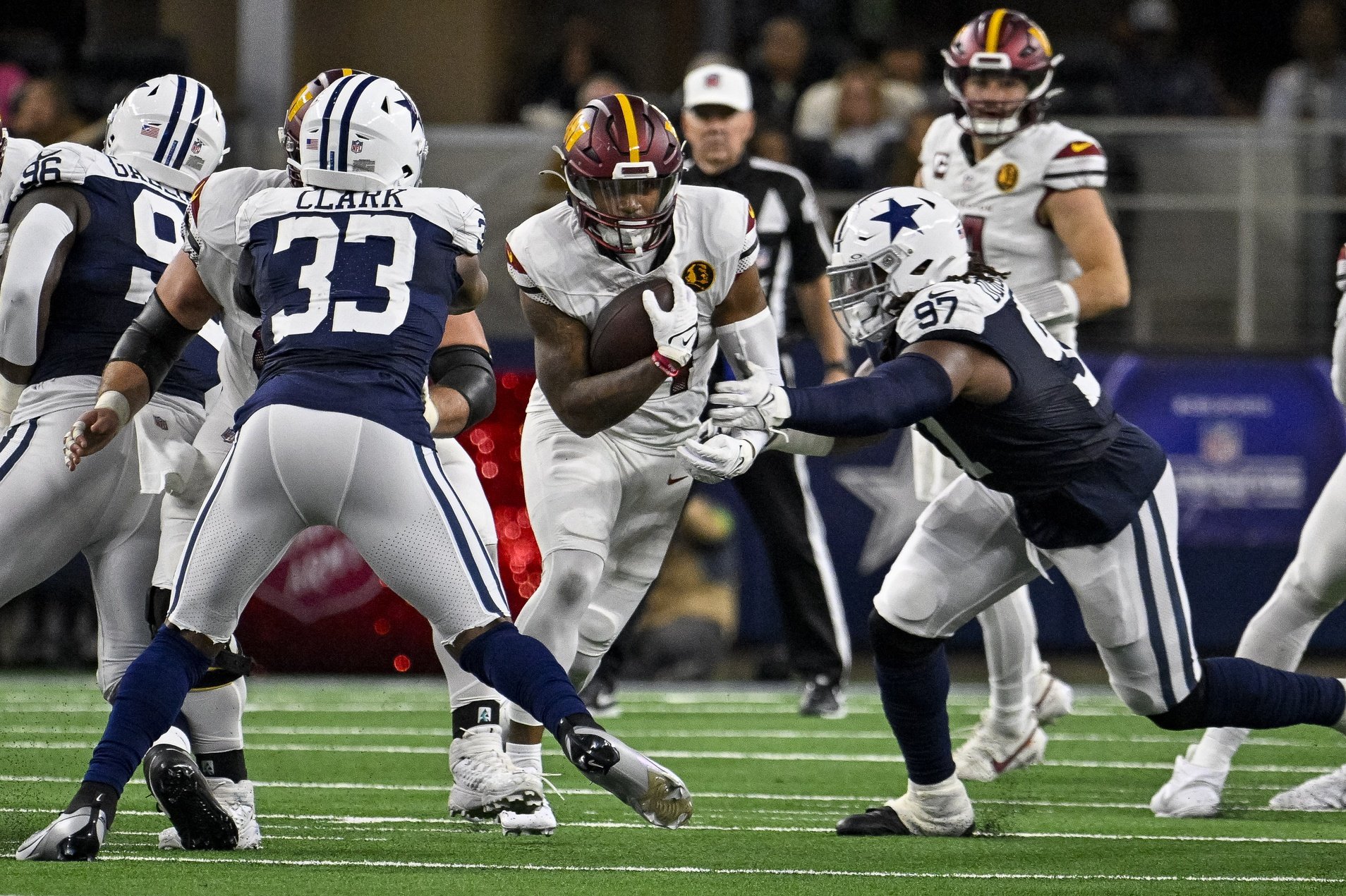 Washington Commanders running back Brian Robinson Jr. (8) in action during the game between the Dallas Cowboys and the Washington Commanders at AT&T Stadium.
