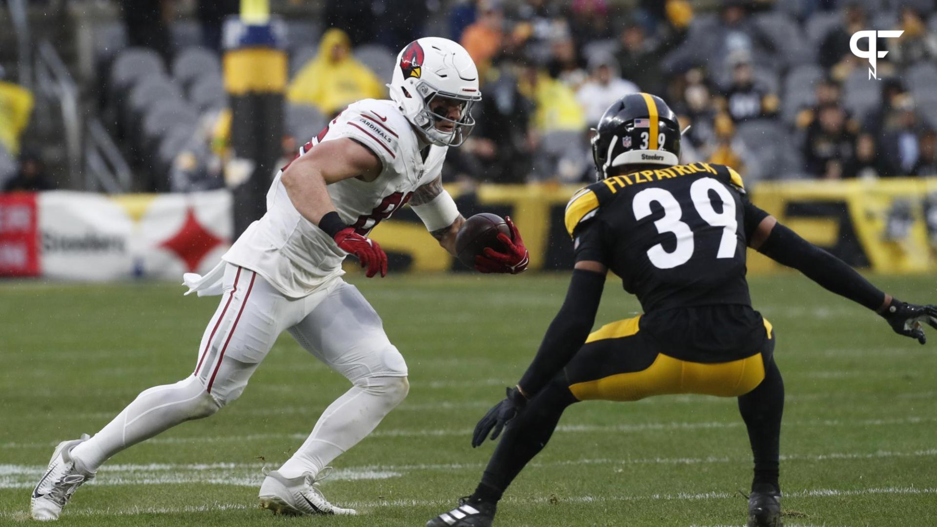 Arizona Cardinals tight end Trey McBride (85) runs after a catch as Pittsburgh Steelers safety Minkah Fitzpatrick (39) defends during the second quarter at Acrisure Stadium.