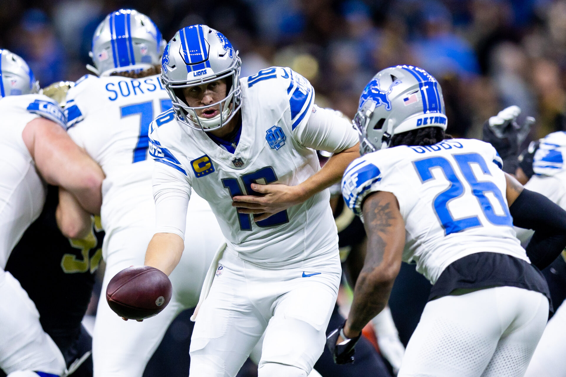 Detroit Lions quarterback Jared Goff (16) hands off to running back Jahmyr Gibbs (26) against the New Orleans Saints during the first half at the Caesars Superdome.