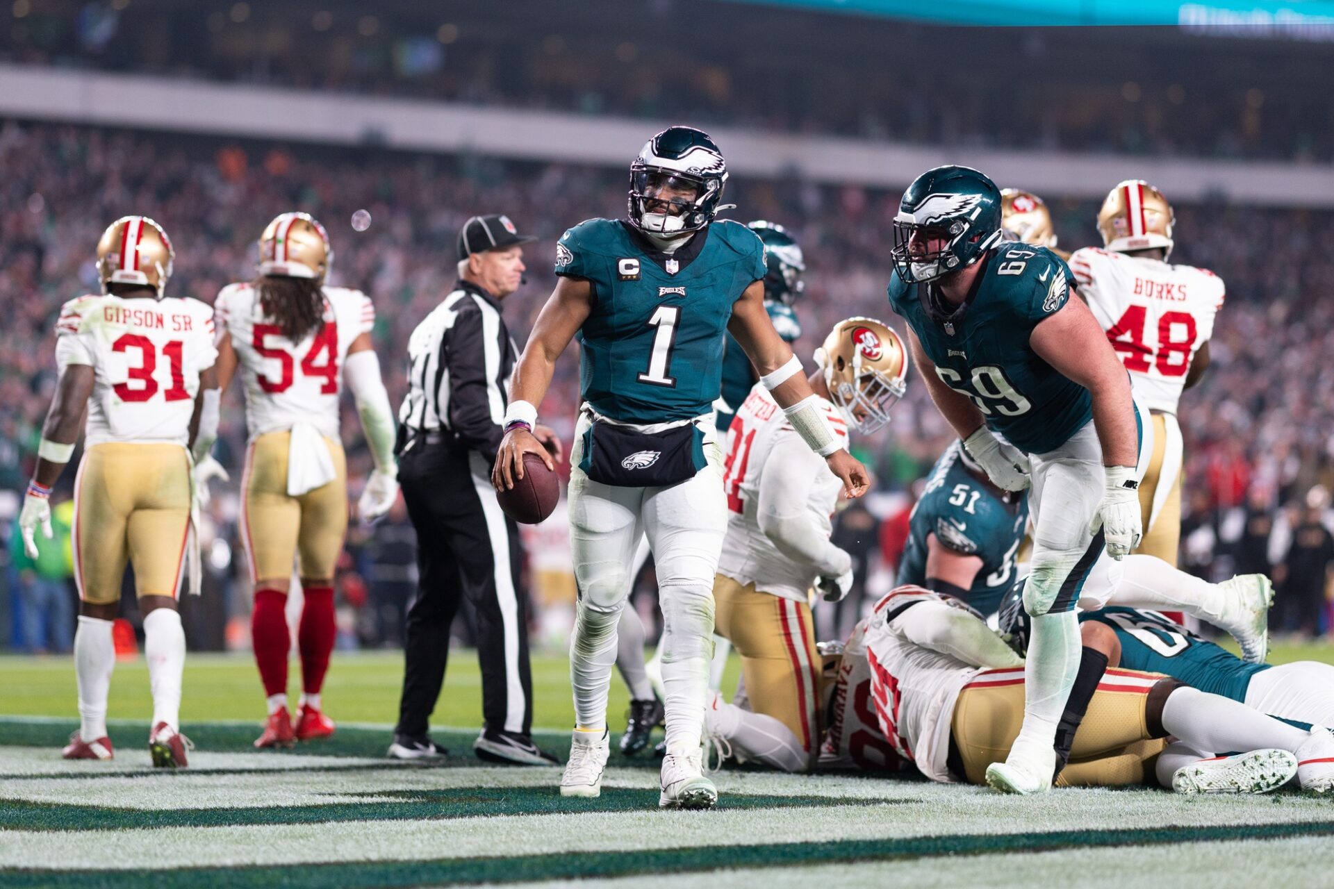 Philadelphia Eagles quarterback Jalen Hurts (1) reacts after scoring a touchdown against the San Francisco 49ers during the third quarter at Lincoln Financial Field.