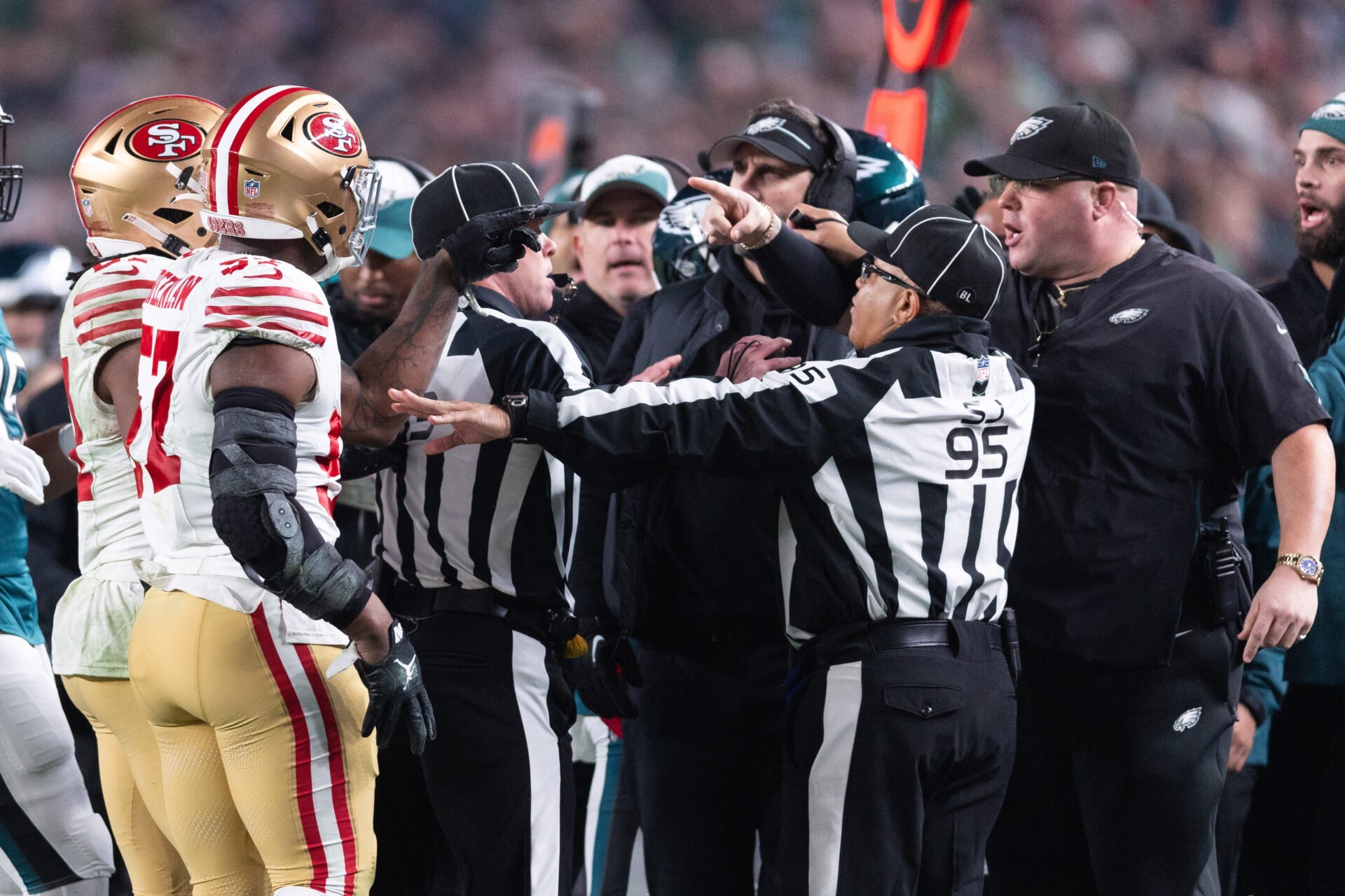 San Francisco 49ers linebacker Dre Greenlaw (57) has an altercation with Philadelphia Eagles staff member Dom DiSandro during the third quarter at Lincoln Financial Field.