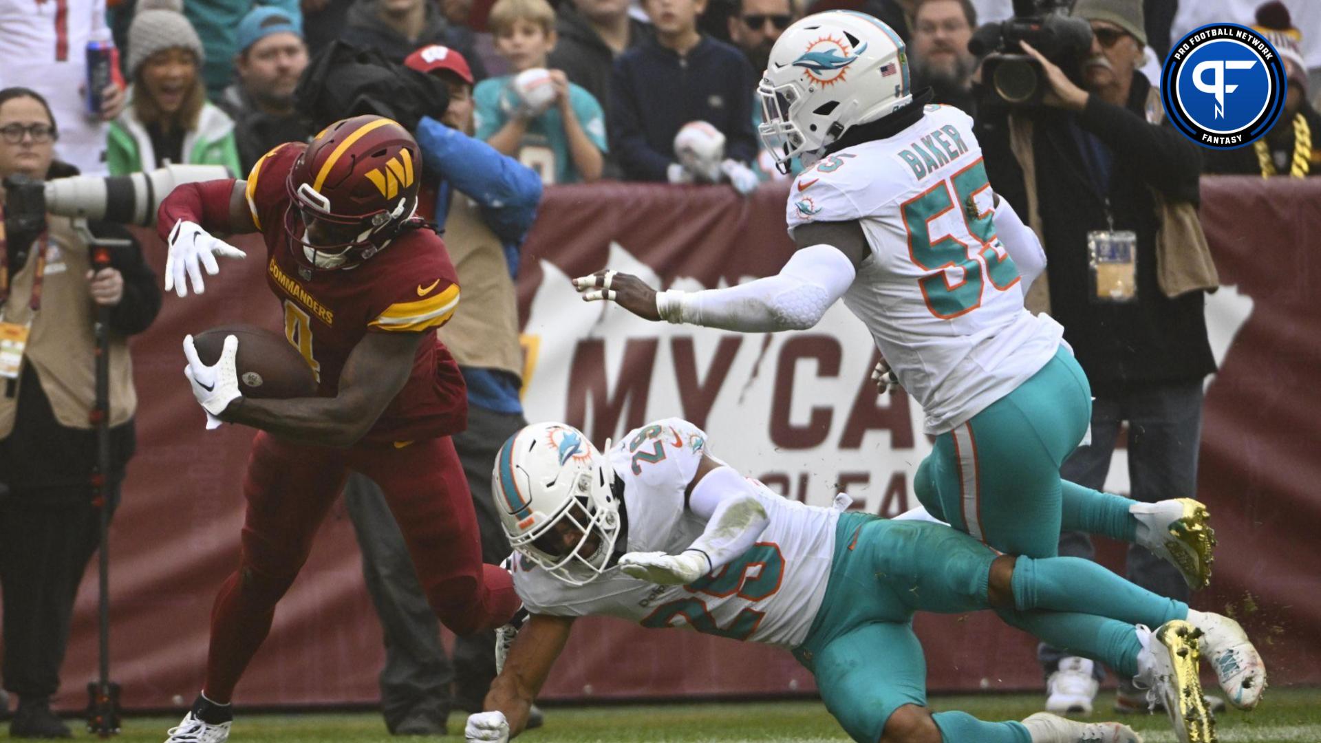 Washington Commanders wide receiver Curtis Samuel (4) reaches for the endzon against the Miami Dolphins during the first half at FedExField.