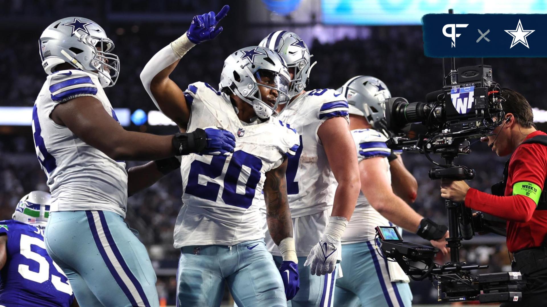 Tony Pollard (20) celebrates after scoring a touchdown against the Seattle Seahawks during the second half at AT&T Stadium.