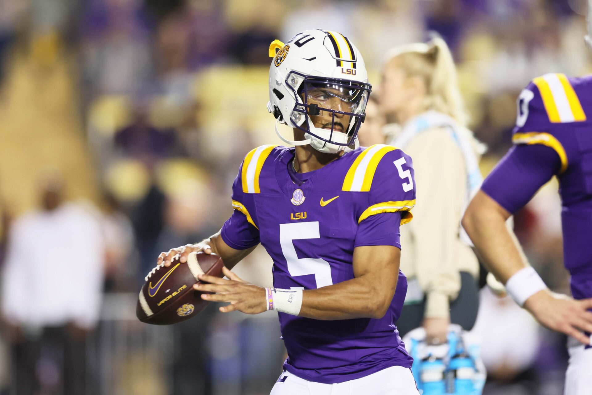 Heisman Trophy candidate LSU Tigers quarterback Jayden Daniels (5) warms up before their game against the Georgia State Panthers at Tiger Stadium.