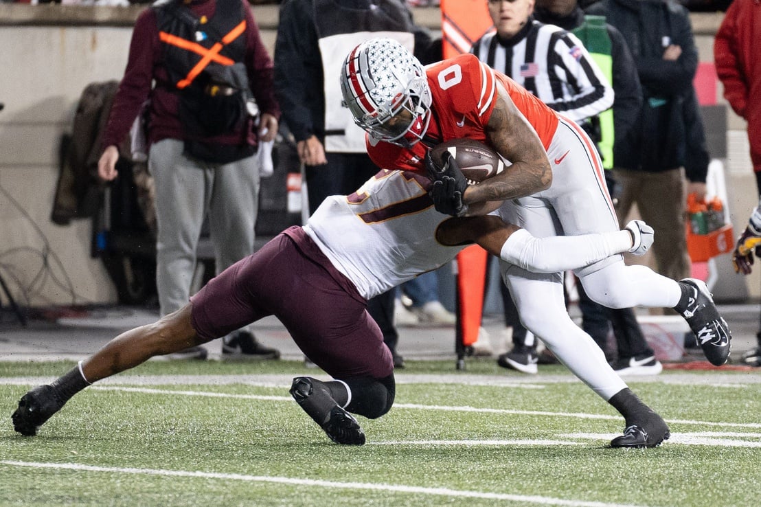 Ohio State Buckeyes wide receiver Xavier Johnson (0) is tackled by Minnesota Golden Gophers defensive back Tyler Nubin (27) during the second half of their game.