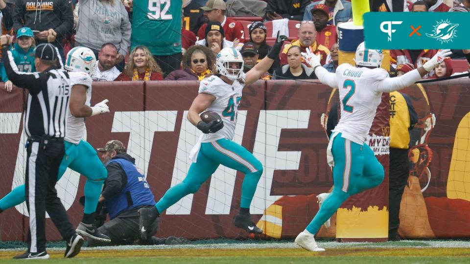 Miami Dolphins linebacker Andrew Van Ginkel (43) celebrates after returning an interception for a touchdown against the Washington Commanders during the second quarter at FedExField.