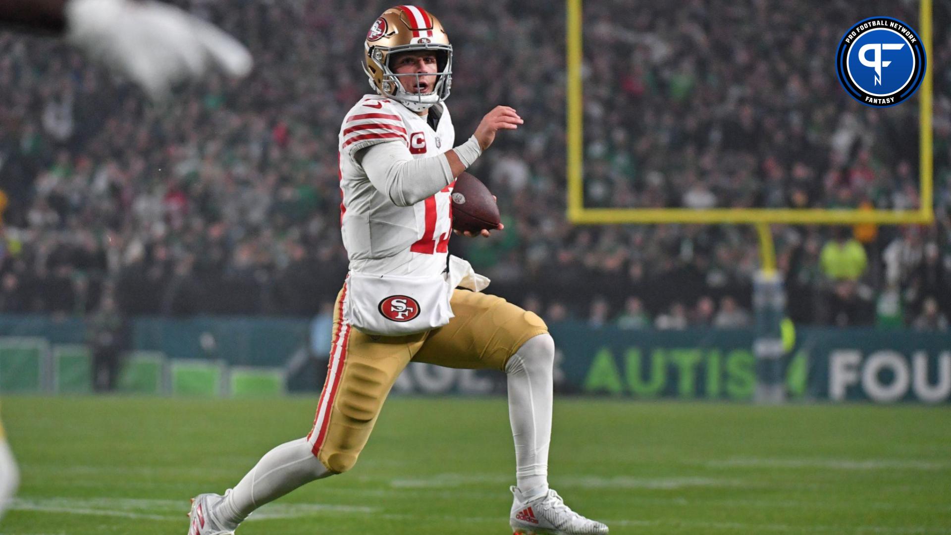 San Francisco 49ers quarterback Brock Purdy (13) carries the football against the Philadelphia Eagles during the second quarter at Lincoln Financial Field.