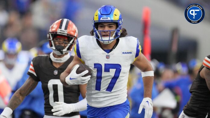 Los Angeles Rams wide receiver Puka Nacua (17) carries the ball against the Cleveland Browns cornerback Greg Newsome II (0) in the second half at SoFi Stadium.