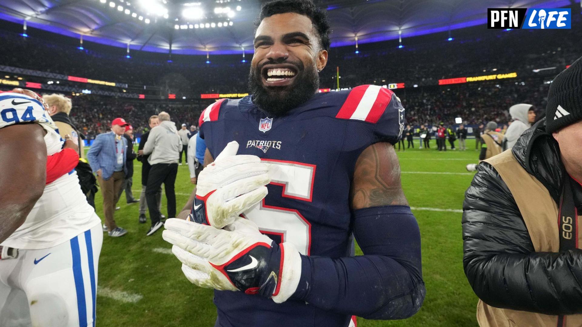 New England Patriots RB Ezekiel Elliott (15) smiling after a game against the Indianapolis Colts.