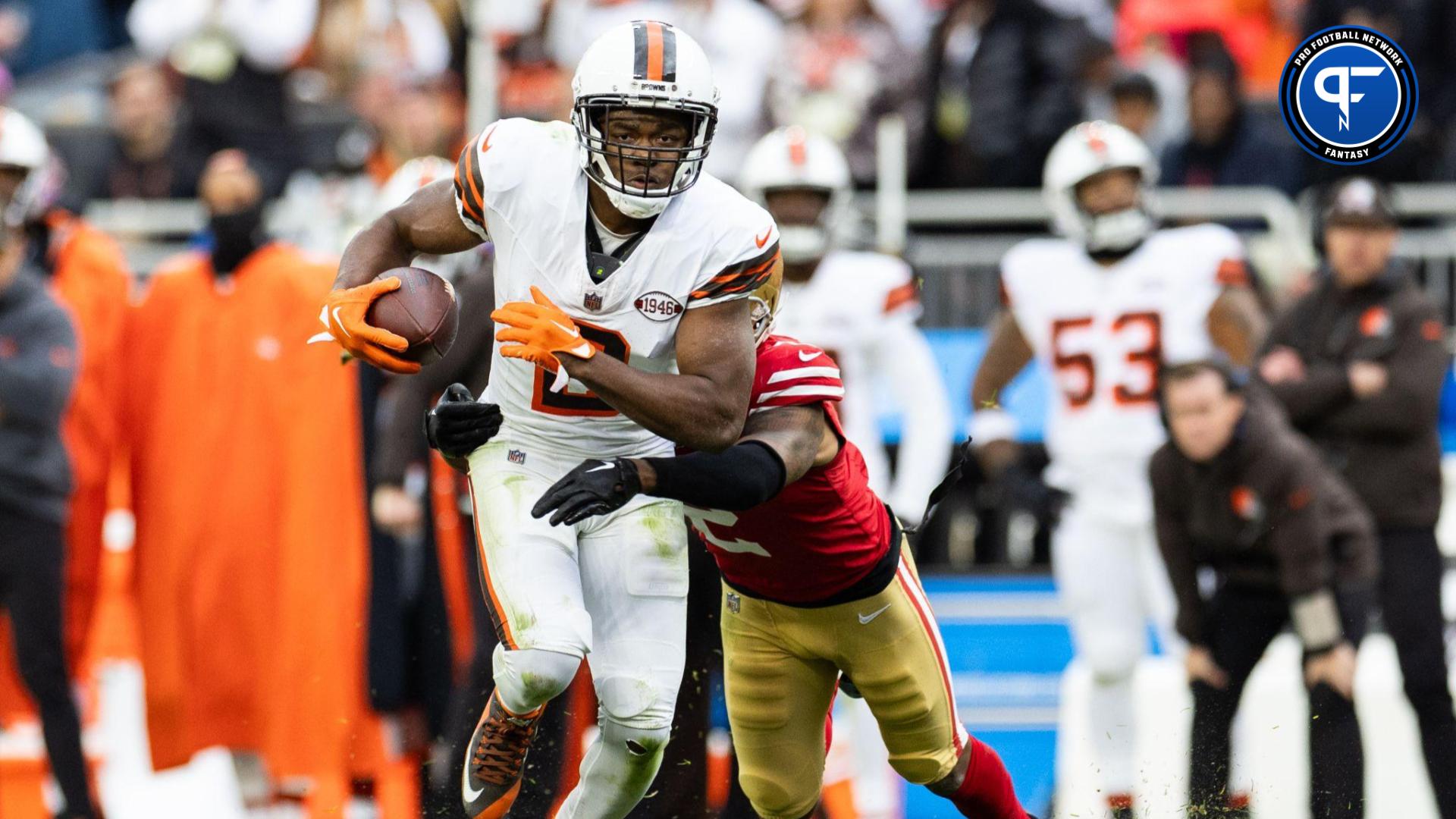 Cleveland Browns wide receiver Amari Cooper (2) runs the ball as San Francisco 49ers cornerback Deommodore Lenoir (2) pulls him down from behind during the fourth quarter at Cleveland Browns Stadium.