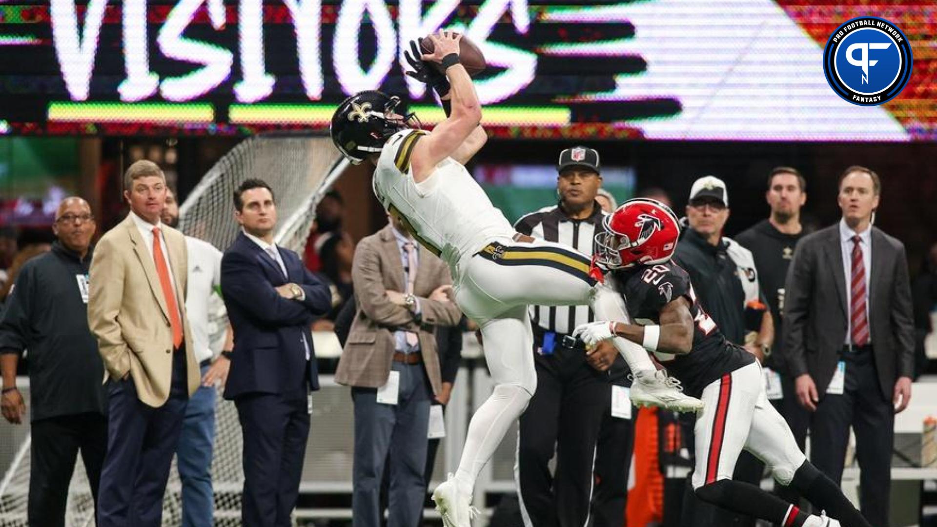 New Orleans Saints quarterback Taysom Hill (7) catches a pass over Atlanta Falcons cornerback Dee Alford (20) in the first quarter at Mercedes-Benz Stadium.