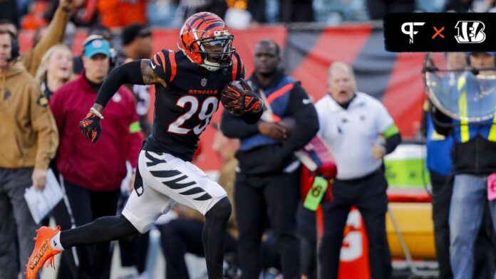 Cincinnati Bengals cornerback Cam Taylor-Britt (29) runs with the ball after intercepting the Houston Texans in the second half at Paycor Stadium.