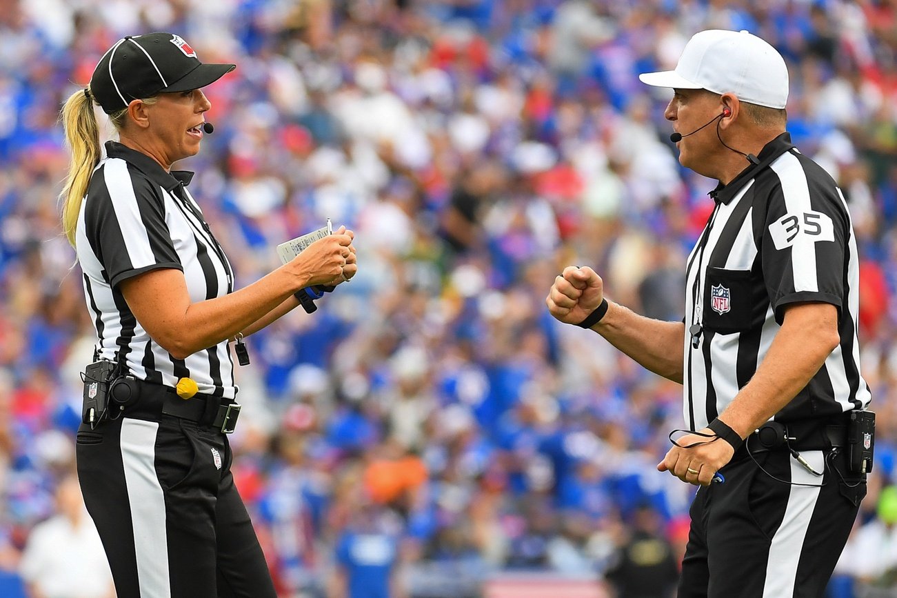 NFL line judge Sarah Thomas (left) talks with referee John Hussey (right) during the second half of the game between the Pittsburgh Steelers and Buffalo Bills at Highmark Stadium.