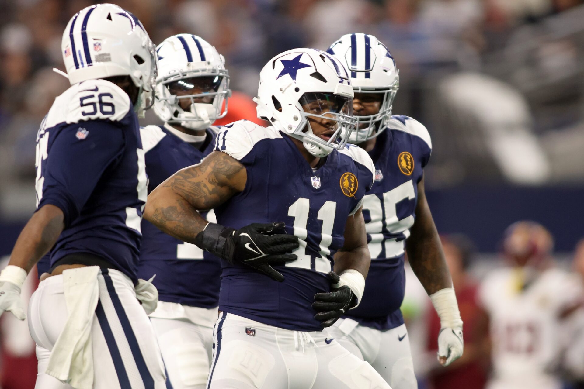 Dallas Cowboys linebacker Micah Parsons (11) celebrates a sack of Washington Commanders quarterback Sam Howell (not pictured) in the fourth quarter at AT&T Stadium.