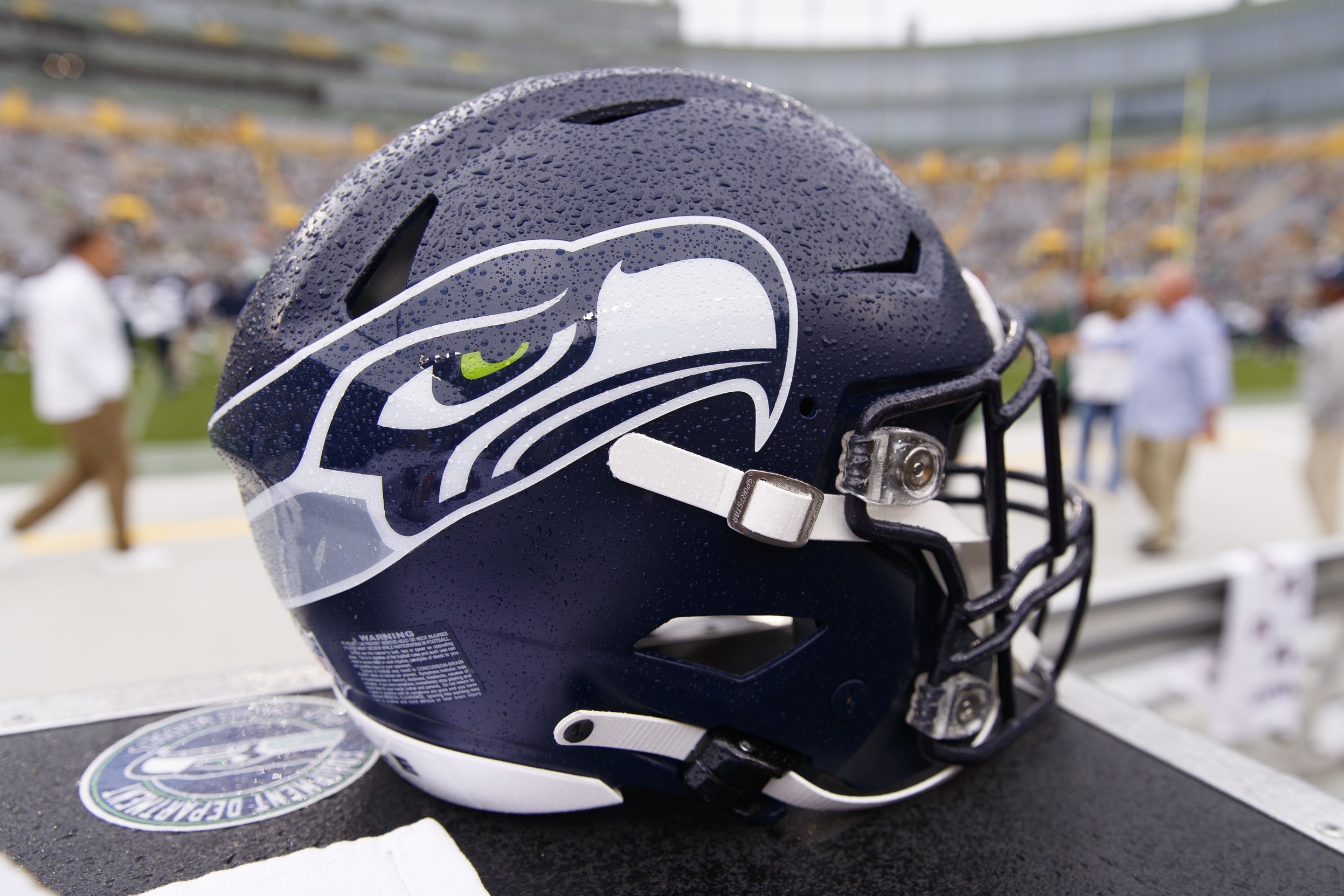 A Seattle Seahawks helmet sits on the sidelines during warmups prior to the game against the Green Bay Packers at Lambeau Field.
