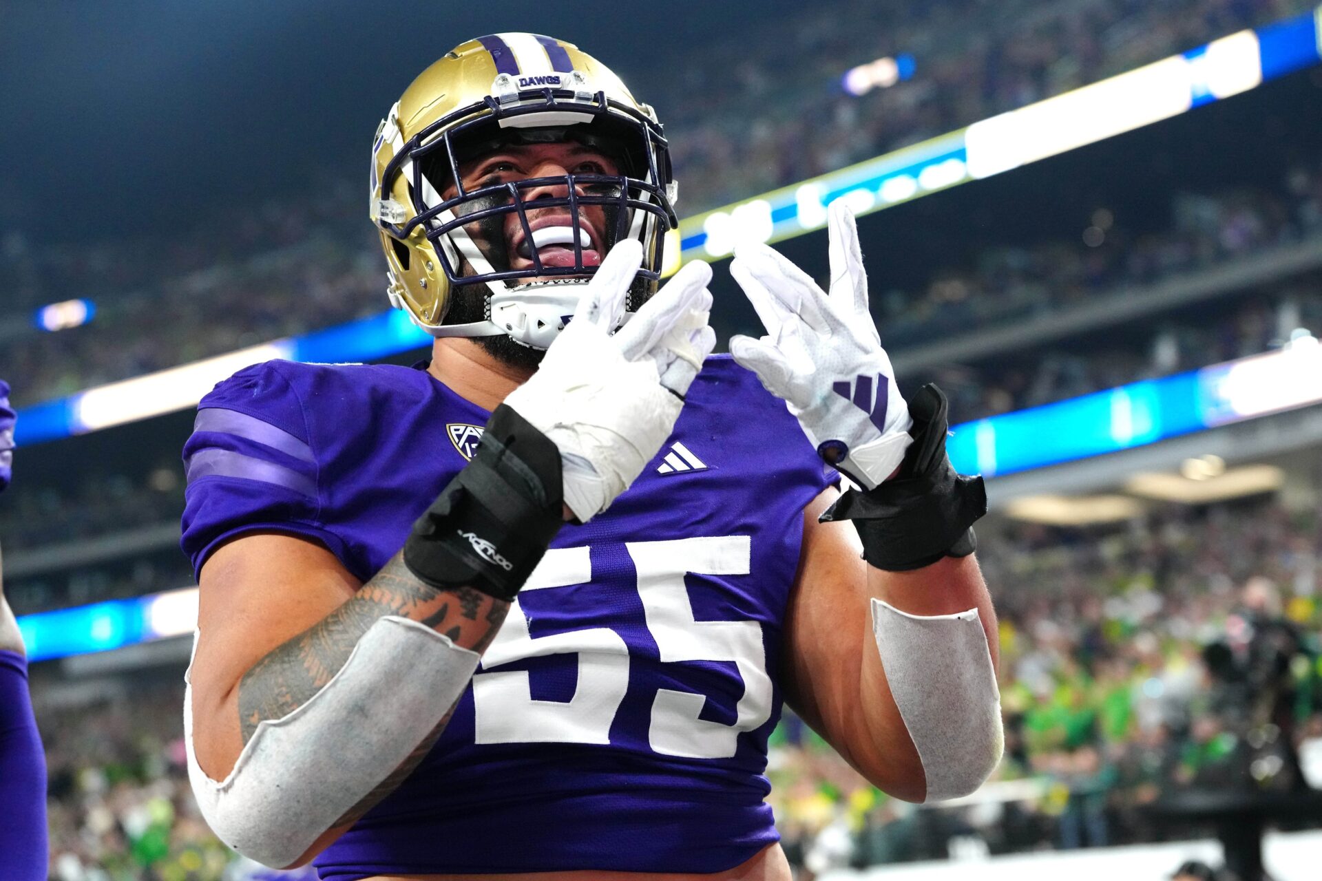 Washington Huskies offensive lineman Troy Fautanu (55) celebrates after the Huskies scored against the Oregon Ducks during the first quarter at Allegiant Stadium.