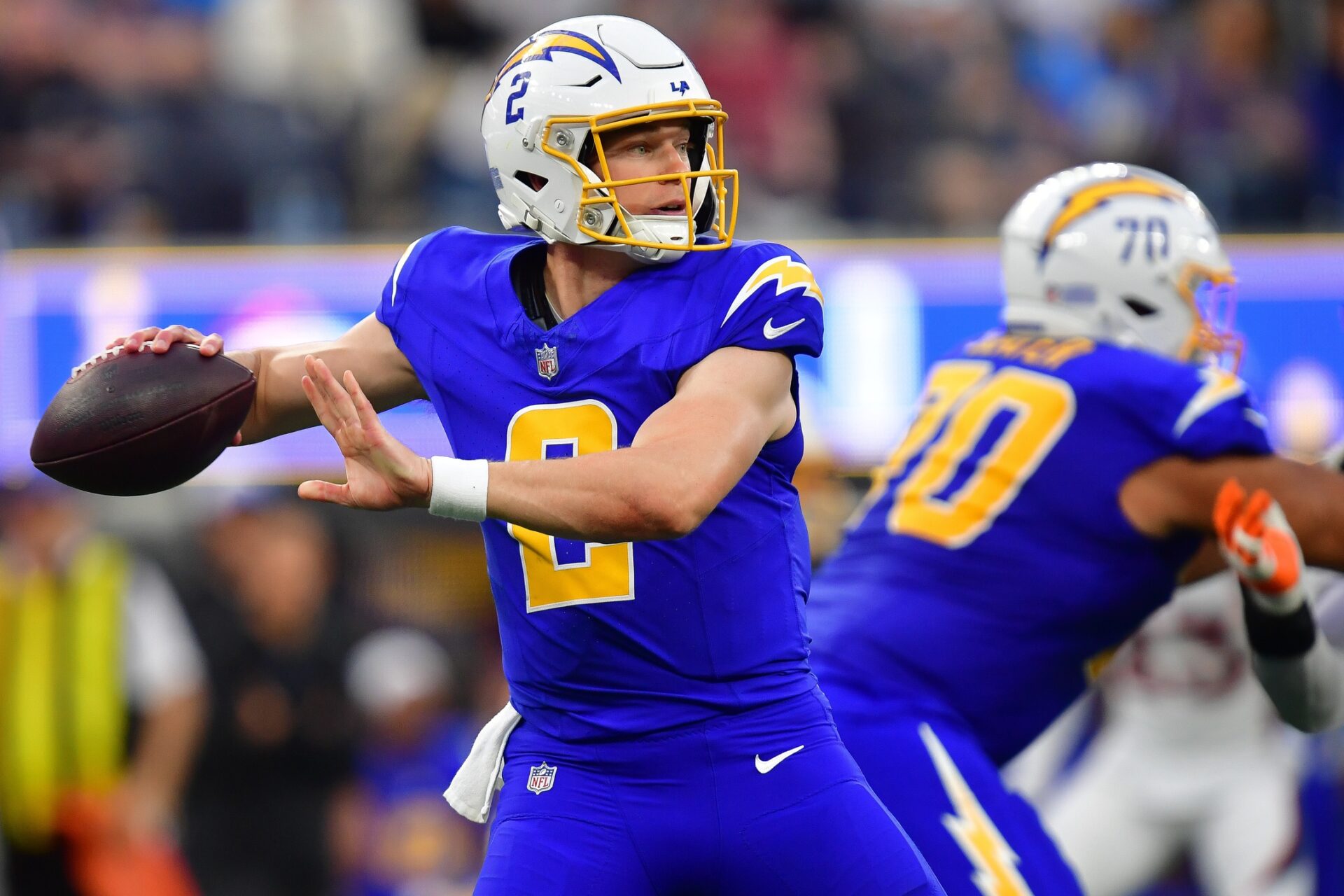 Los Angeles Chargers quarterback Easton Stick (2) throws against the Denver Broncos during the second half at SoFi Stadium.