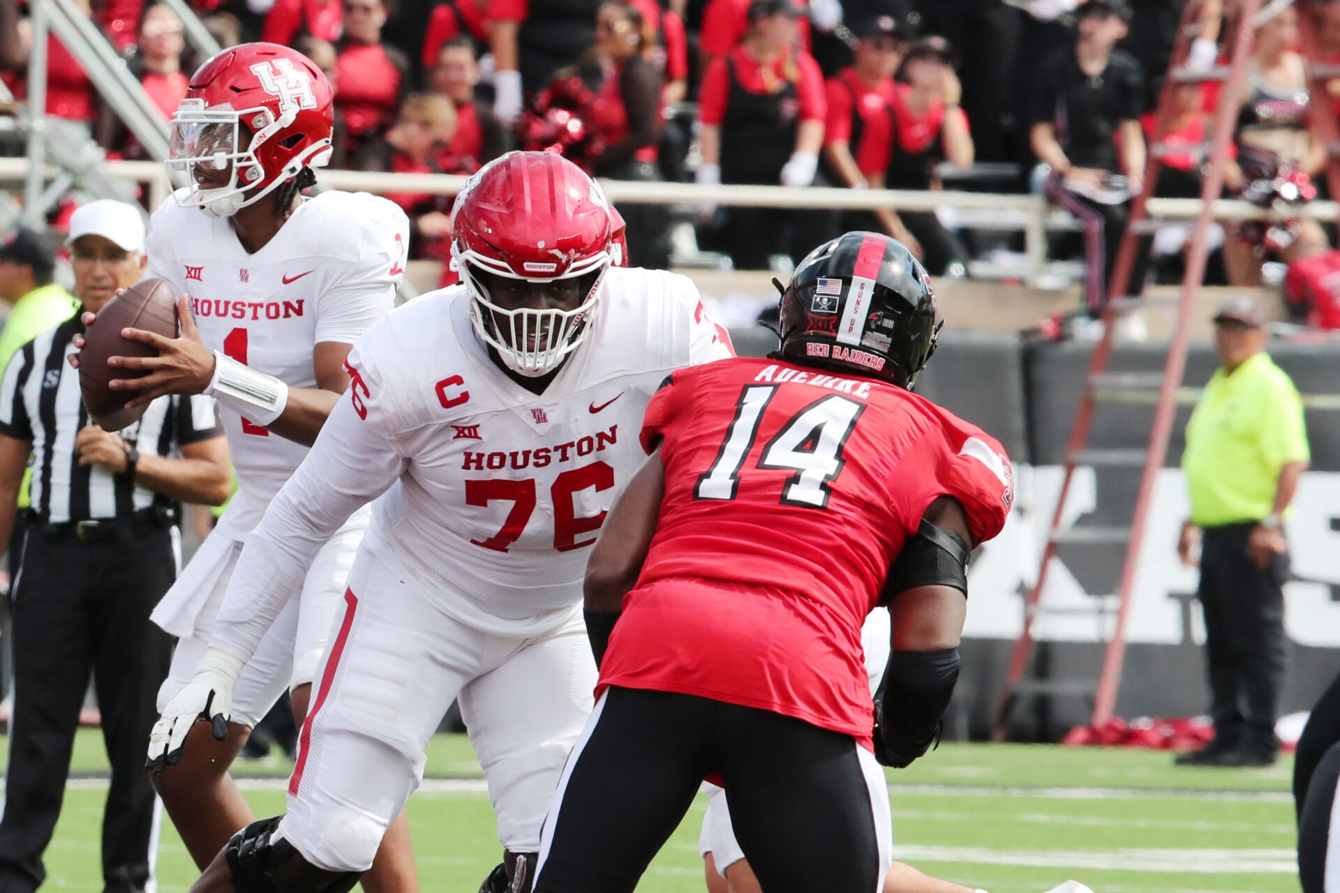 Houston Cougars offensive tackle Patrick Paul (76) blocks Texas Tech Red Raiders defensive end Joseph Adedire (14) in the second half at Jones AT&T Stadium and Cody Campbell Field.