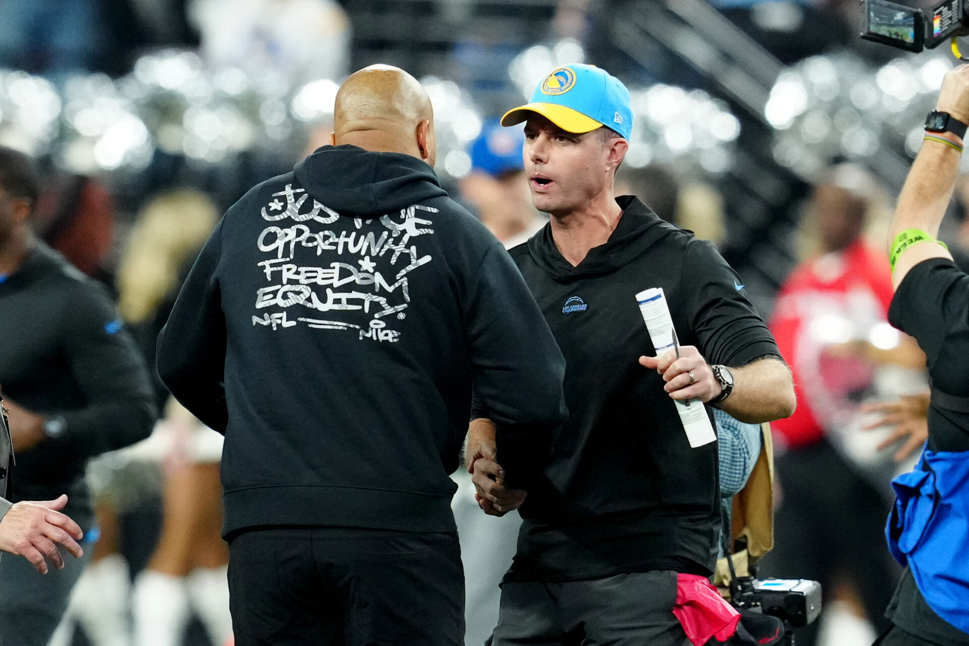 Los Angeles Chargers head coach Brandon Staley shakes hands with Las Vegas Raiders head coach Antonio Pierce after the game at Allegiant Stadium.