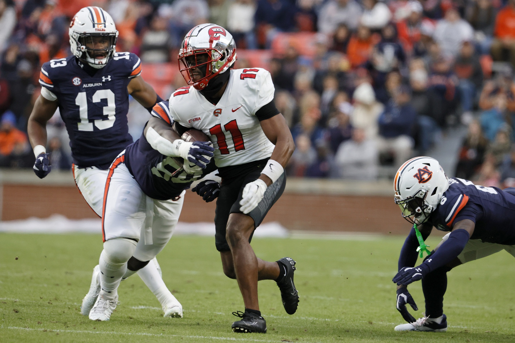 Western Kentucky Hilltoppers WR Malachi Corley (11) runs with the ball against Auburn.