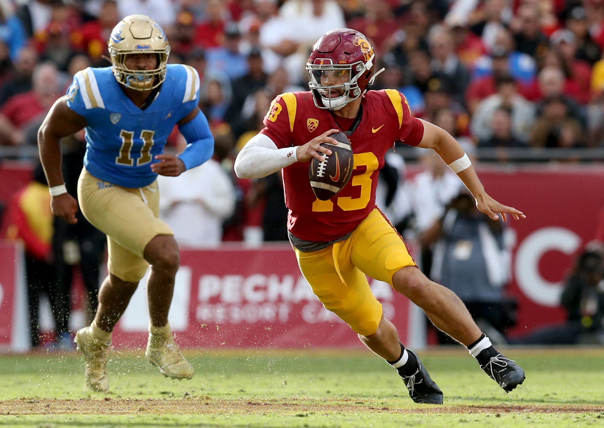 USC Trojans quarterback Caleb Williams (13) scrambles during the third quarter against the UCLA Bruins at United Airlines Field at Los Angeles Memorial Coliseum.