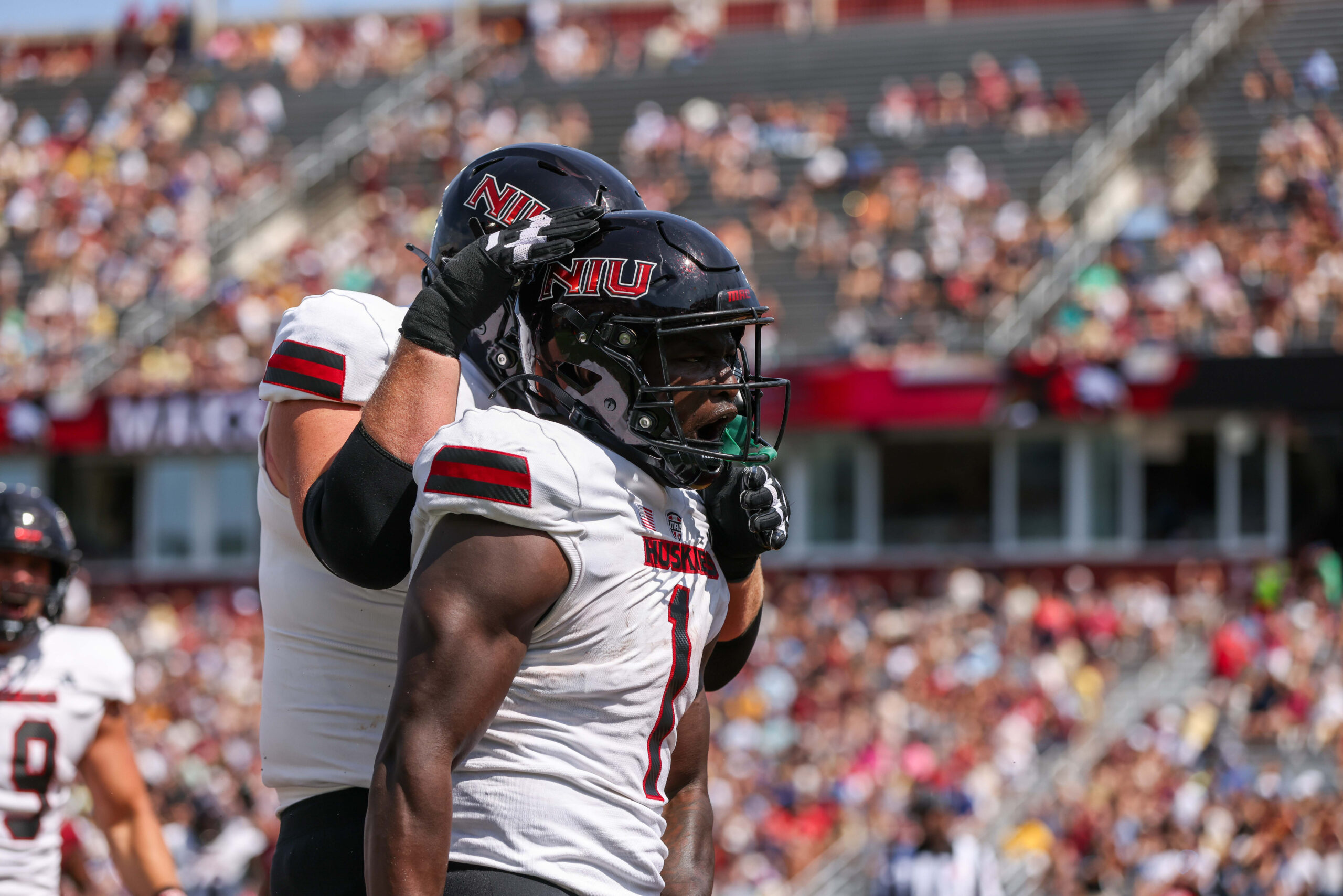 Northern Illinois Huskies running back Antario Brown (1) reacts after scoring a touchdown during the first half against the Boston College Eagles at Alumni Stadium.