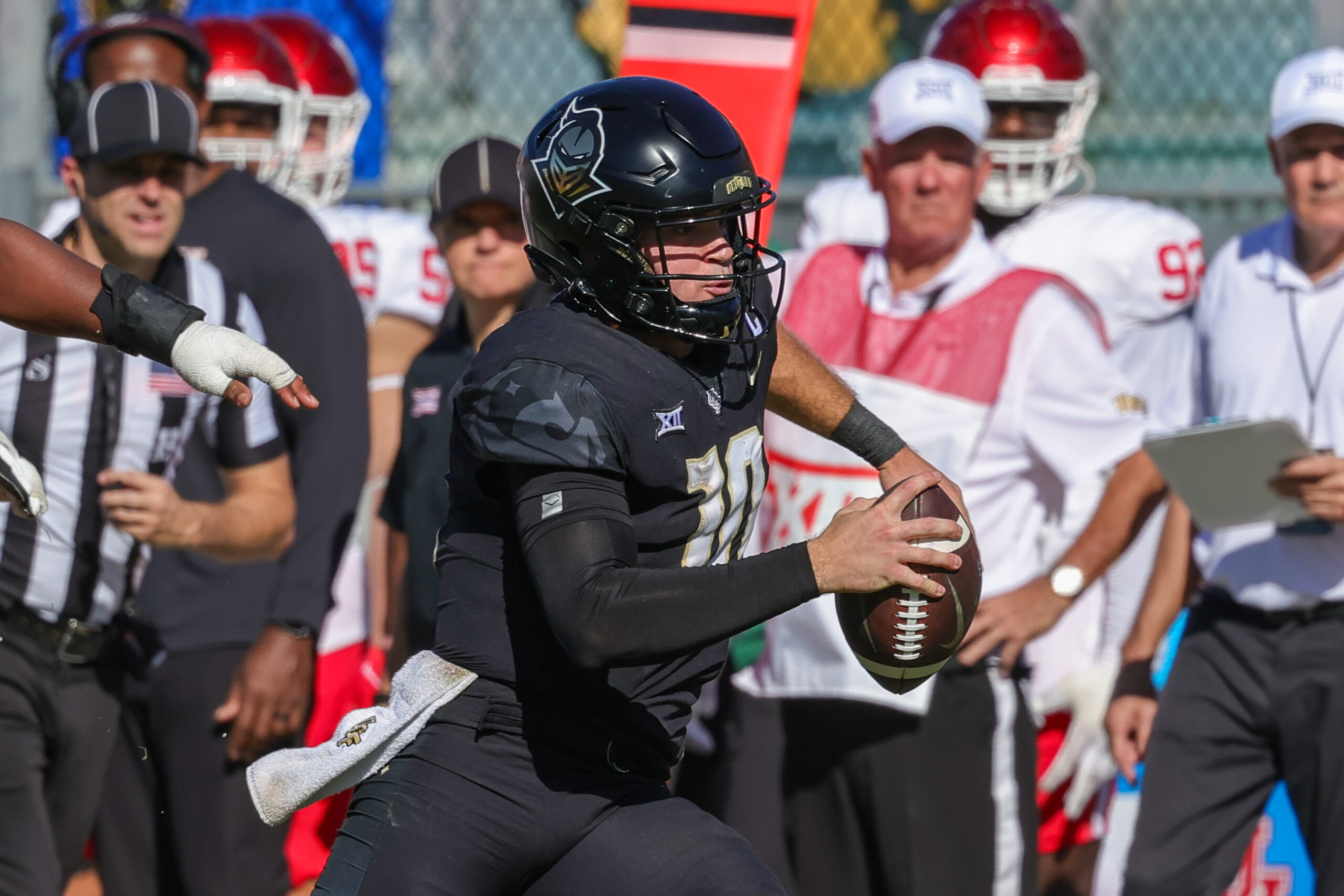 UCF Knights quarterback John Rhys Plumlee (10) carries the ball during the second half against the Houston Cougars at FBC Mortgage Stadium.