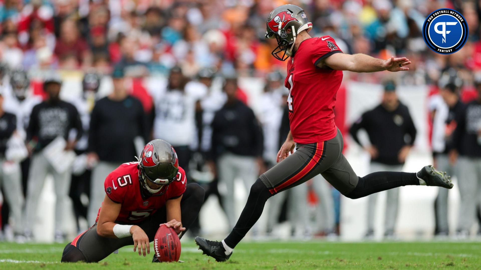 Tampa Bay Buccaneers place kicker Chase McLaughlin (4) kicks a field goal held by punter Jake Camarda (5) against the Jacksonville Jaguars in the first quarter at Raymond James Stadium.