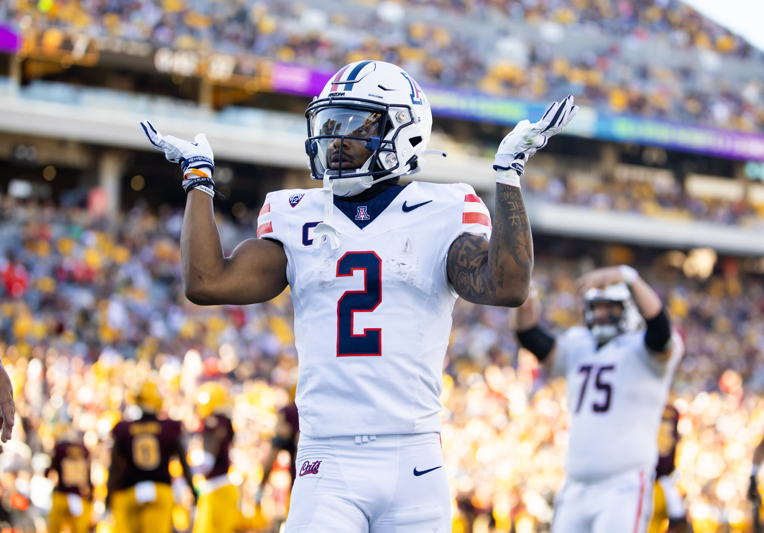 Arizona Wildcats running back Jacob Cowing (2) reacts after a touchdown against the Arizona State Sun Devils in the second half of the Territorial Cup at Mountain America Stadium.