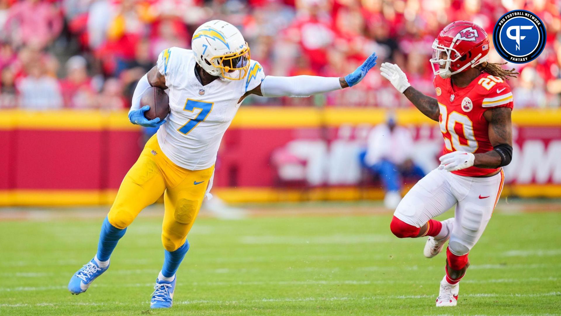 Los Angeles Chargers tight end Gerald Everett (7) runs with the ball against Kansas City Chiefs safety Justin Reid (20) during the first half at GEHA Field at Arrowhead Stadium.
