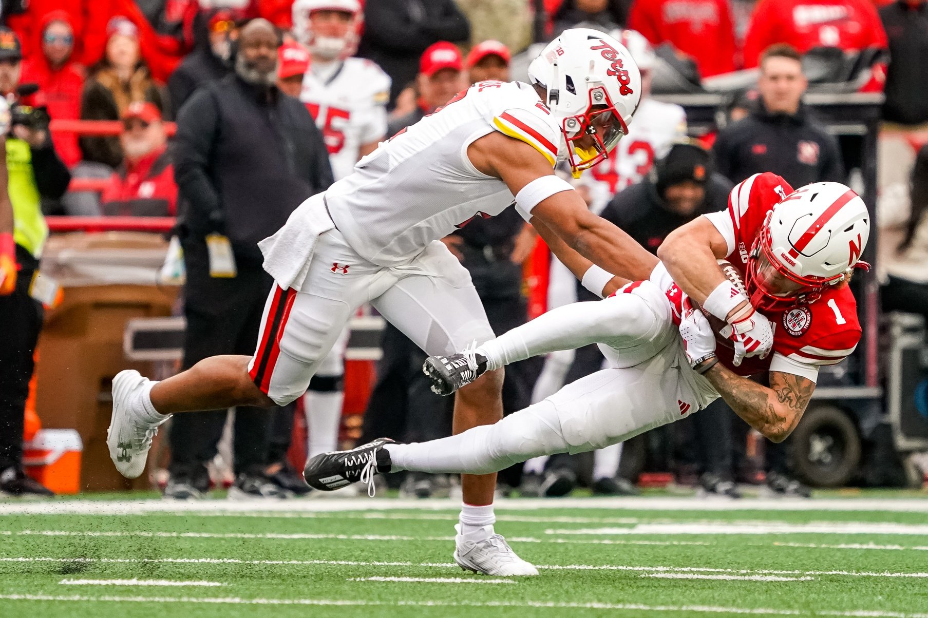 Nebraska Cornhuskers wide receiver Billy Kemp IV (1) is brought down by Maryland Terrapins defensive back Beau Brade (2) during the second quarter at Memorial Stadium.