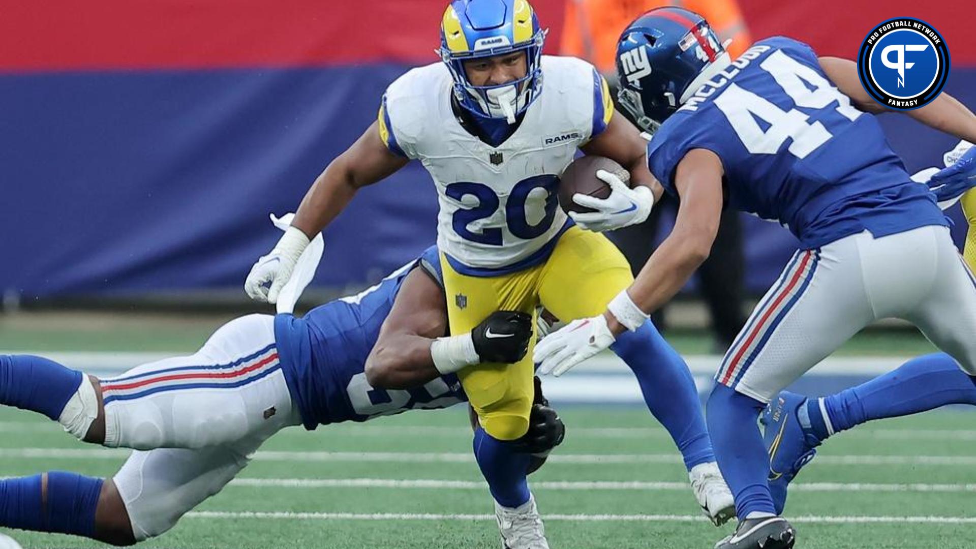 Los Angeles Rams running back Ronnie Rivers (20) runs with the ball against New York Giants linebacker Bobby Okereke (58) and cornerback Nick McCloud (44) during the third quarter at MetLife Stadium.
