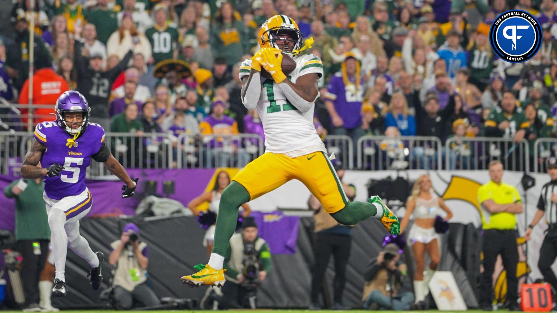 Green Bay Packers wide receiver Jayden Reed (11) catches a pass for a touchdown against the Minnesota Vikings in the first quarter at U.S. Bank Stadium.