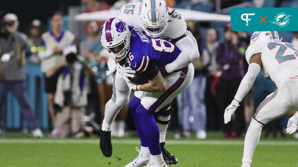 Buffalo Bills tight end Dalton Kincaid (86) is tackled by Miami Dolphins linebacker Jerome Baker (55) after running with the football during the second quarter at Hard Rock Stadium.