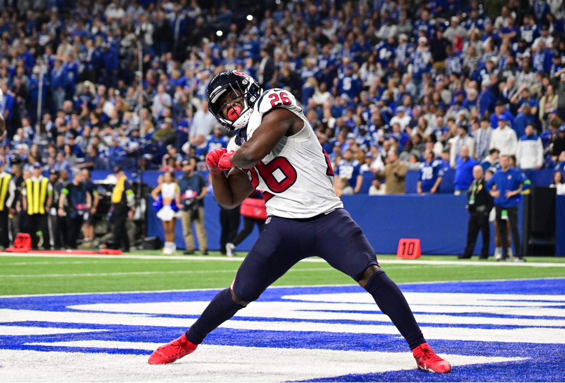 Houston Texans running back Devin Singletary (26) celebrates after a touchdown against the Indianapolis Colts during the second half at Lucas Oil Stadium.