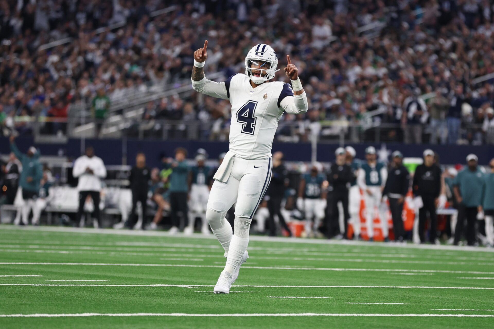Dallas Cowboys quarterback Dak Prescott (4) celebrates a touchdown in the second quarter against the Philadelphia Eagles at AT&T Stadium.