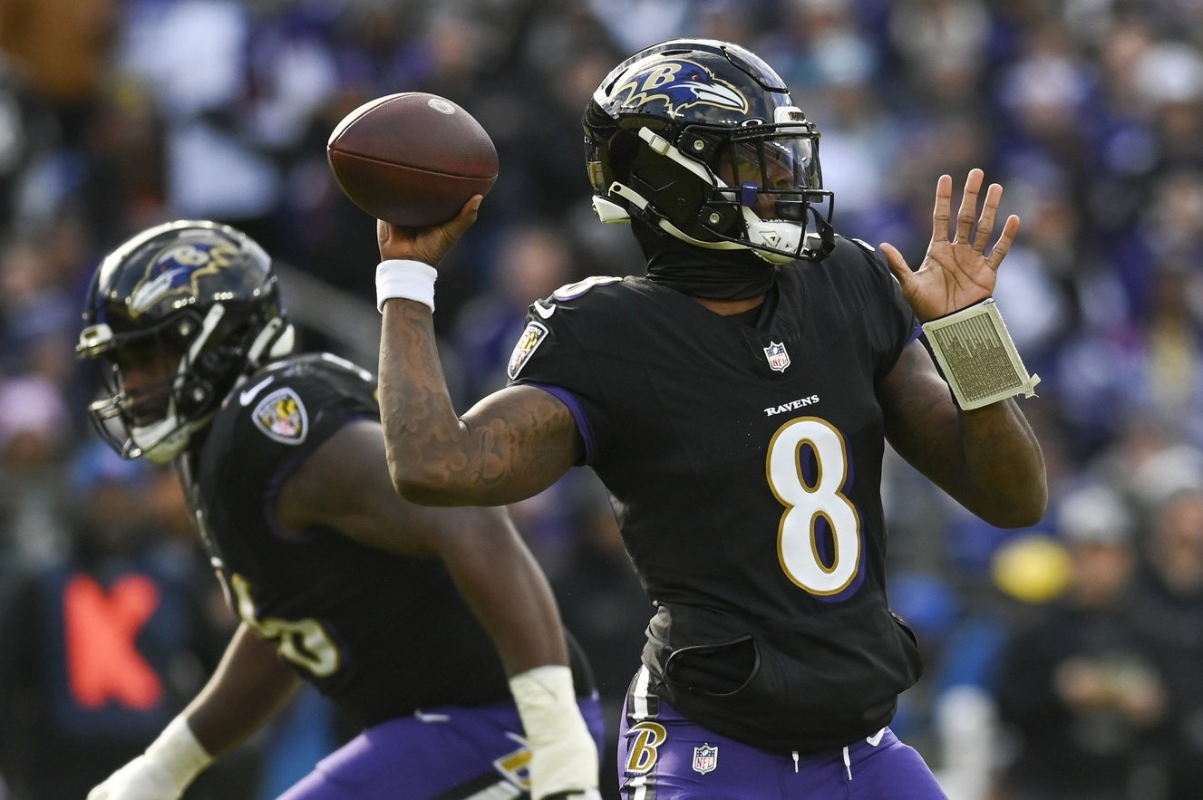 Baltimore Ravens quarterback Lamar Jackson (8) throws during the during the first quarter against the Miami Dolphins at M&T Bank Stadium.