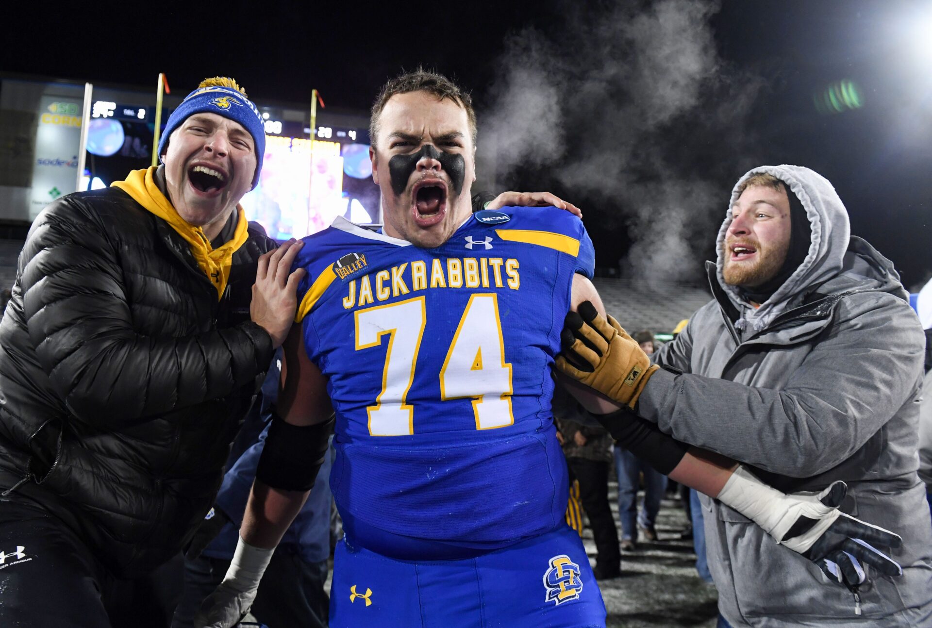 South Dakota State’s Garret Greenfield yells in celebration with friends after the team beats Montana State in the FCS semifinals on Saturday, December 17, 2022, at Dana J. Dykhouse Stadium in Brookings, SD.