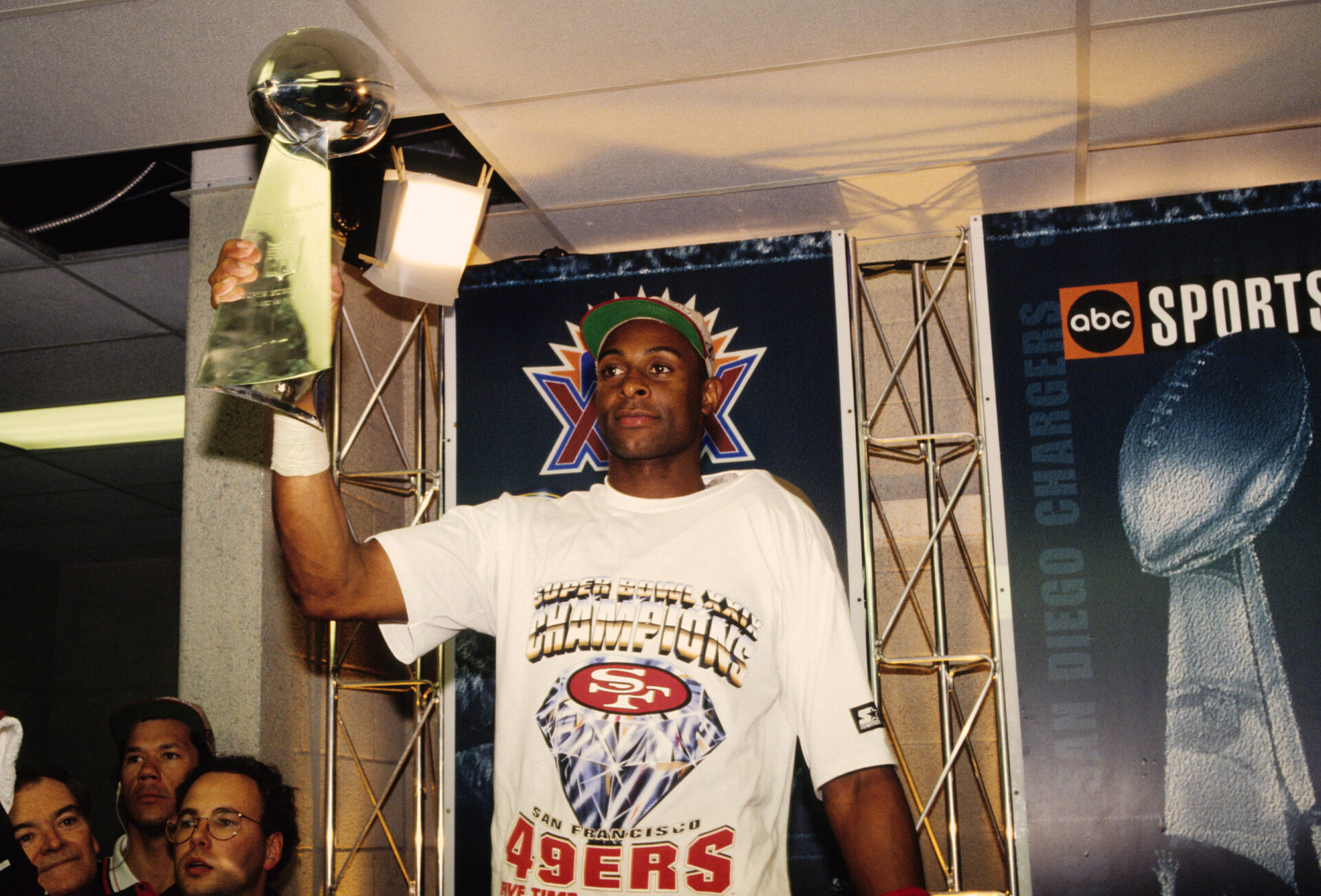 San Francisco 49ers receiver Jerry Rice (80) holds up the Lombardi trophy after winning Super Bowl XXIX against the San Diego Chargers at Joe Robbie Stadium.