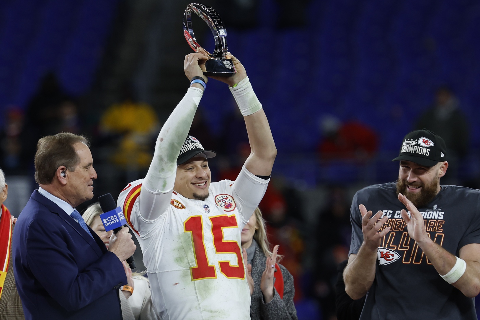 Kansas City Chiefs quarterback Patrick Mahomes (15) celebrates with the Lamar Hunt Trophy while speaking with CBS broadcaster Jim Nance during the trophy presentation after the Chiefs' game against the Baltimore Ravens in the AFC Championship football game at M&T Bank Stadium.
