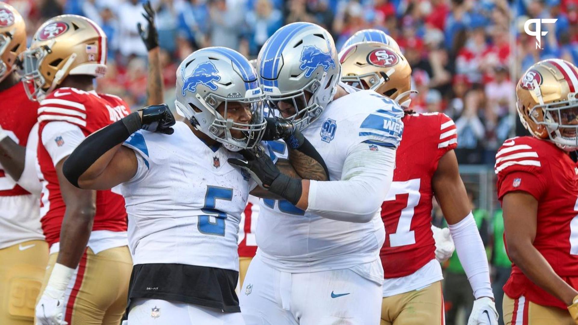 Lions running back David Montgomery, left, and offensive tackle Penei Sewell celebrate a touchdown in the first quarter of the NFC championship game at Levi's Stadium.