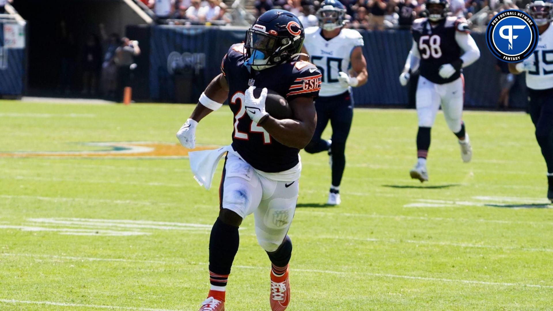 Chicago Bears running back Khalil Herbert (24) catches a pass and runs for a touchdown against the Tennessee Titans during the first quarter at Soldier Field.