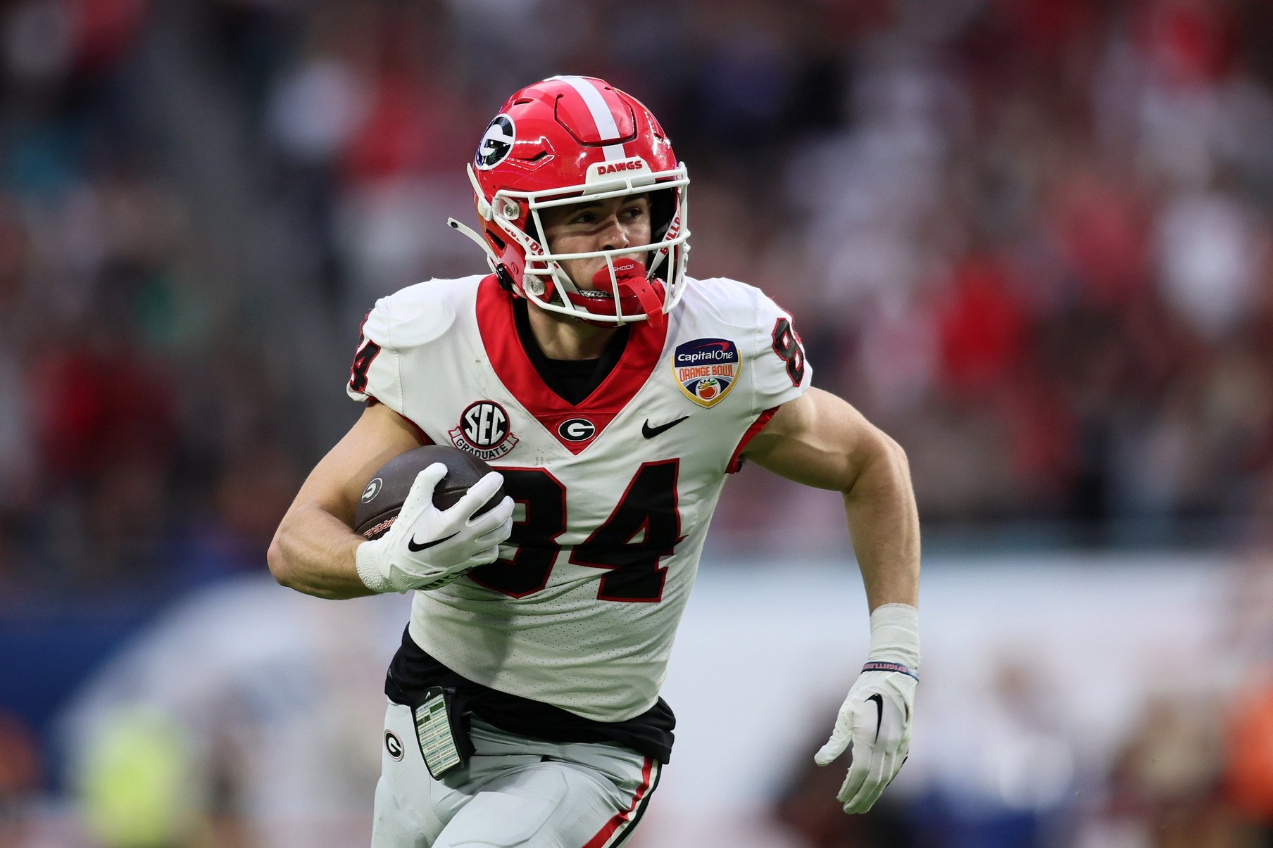 Georgia Bulldogs WR Ladd McConkey (84) runs after the catch against the Florida State Seminoles.